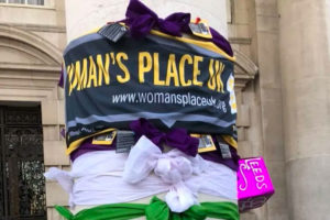 Woman's Place UK banner tied to a tree in protest ©WPUK